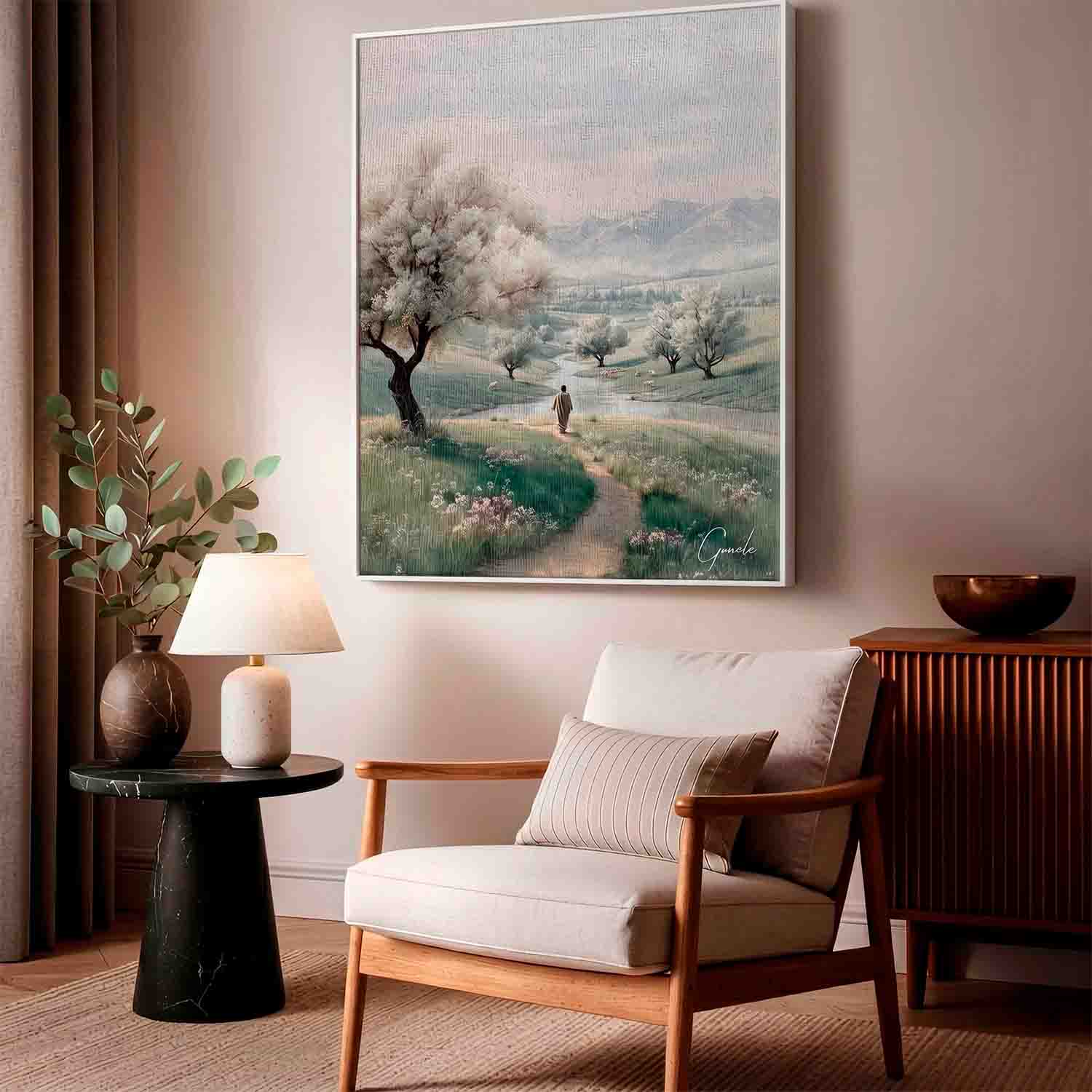 Figure strolling a winding path through a lush green landscape with distant mountains