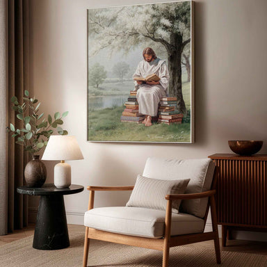 Religious wall art depicting a serene, realistic depiction of Christ reading in nature