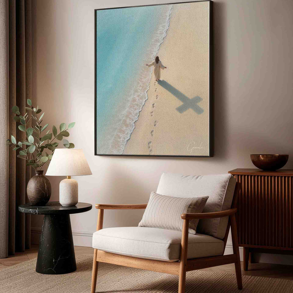 Footprints trail behind the figure toward a turquoise ocean