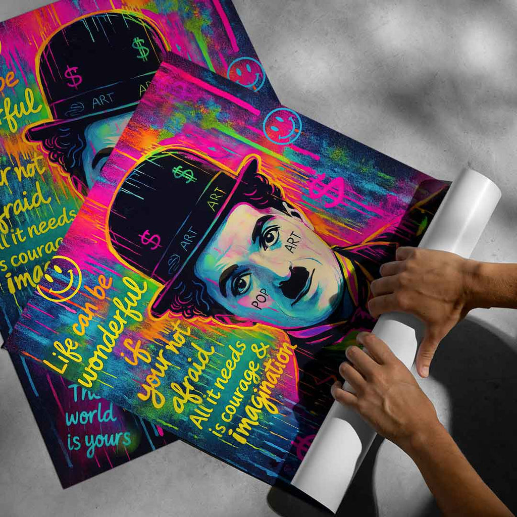 Pop art mural print of Charlie Chaplin, high-contrast neon colors on a dark backdrop for modern living spaces.