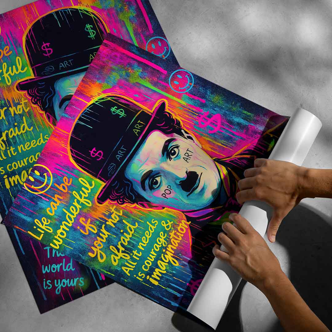 Pop art mural print of Charlie Chaplin, high-contrast neon colors on a dark backdrop for modern living spaces.