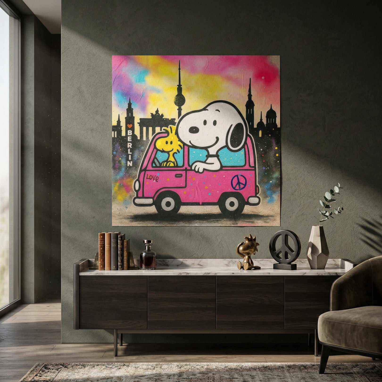 Close-up of the pink van showing the word 'Love' and a peace sign against a graffiti-colored sky.