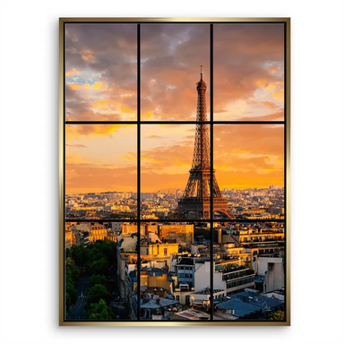 Wide cityscape of Paris at sunset with golden clouds over the skyline