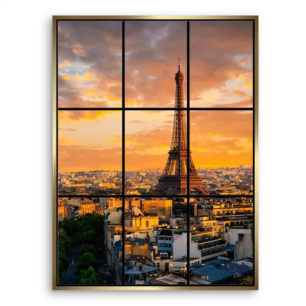 Wide cityscape of Paris at sunset with golden clouds over the skyline