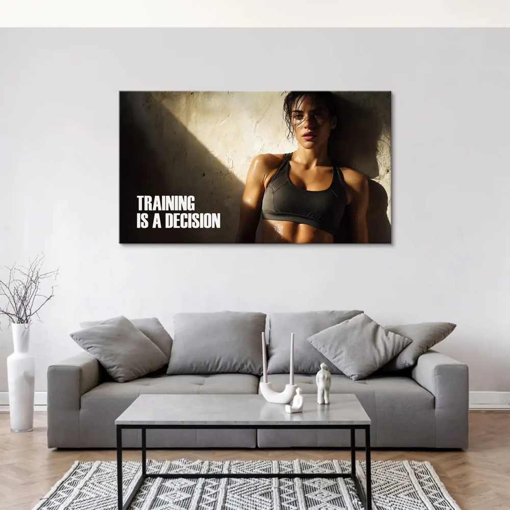 Canvas art with bold white text TRAINING IS A DECISION beside an athlete under dramatic lighting