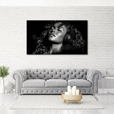 High-contrast photography of a serene woman with curly hair and headphones