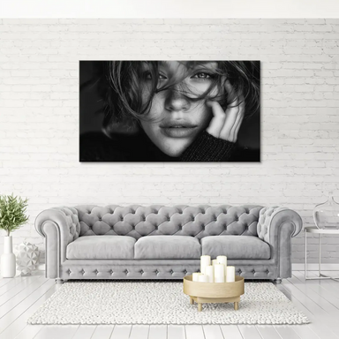 Monochrome canvas art featuring a thoughtful woman's face