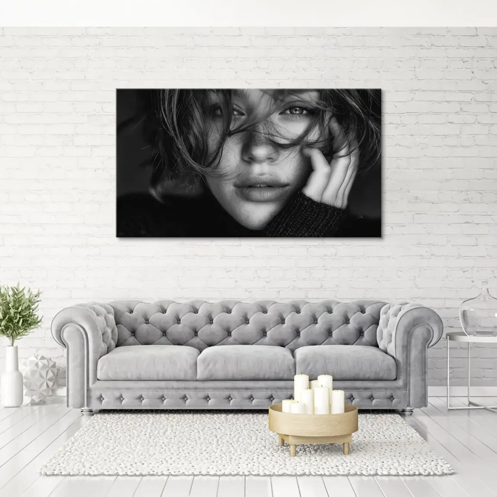 Monochrome canvas art featuring a thoughtful woman's face