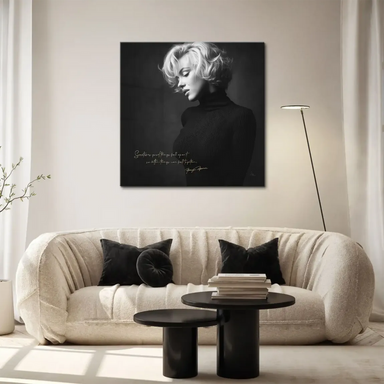 Black-and-white Marilyn Monroe close-up with reflective gaze and vintage styling