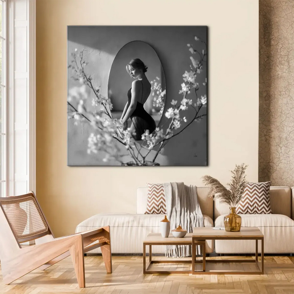 Monochrome fine art photograph featuring a backless-dress woman in a calm, introspective pose.