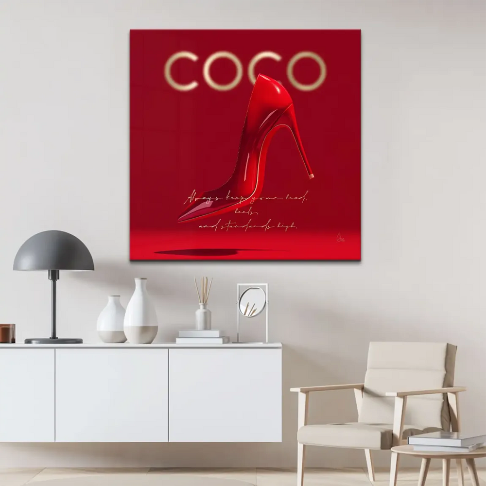 Fashion wall art with a floating red heel and gold branding on a glossy crimson backdrop.