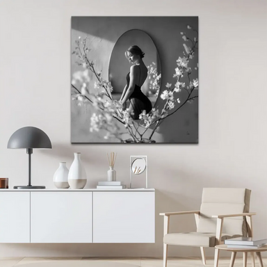Elegant composition showing the oval mirror and portrait against a minimalist background.