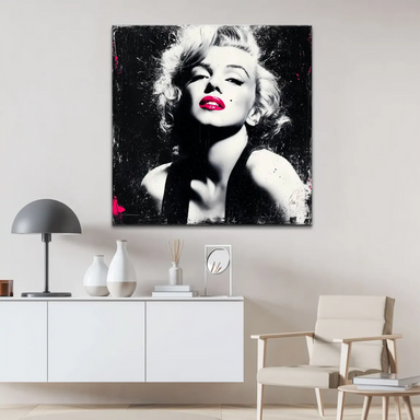 Close-up of Marilyn Monroe's face in high-contrast black-and-white with pink lips
