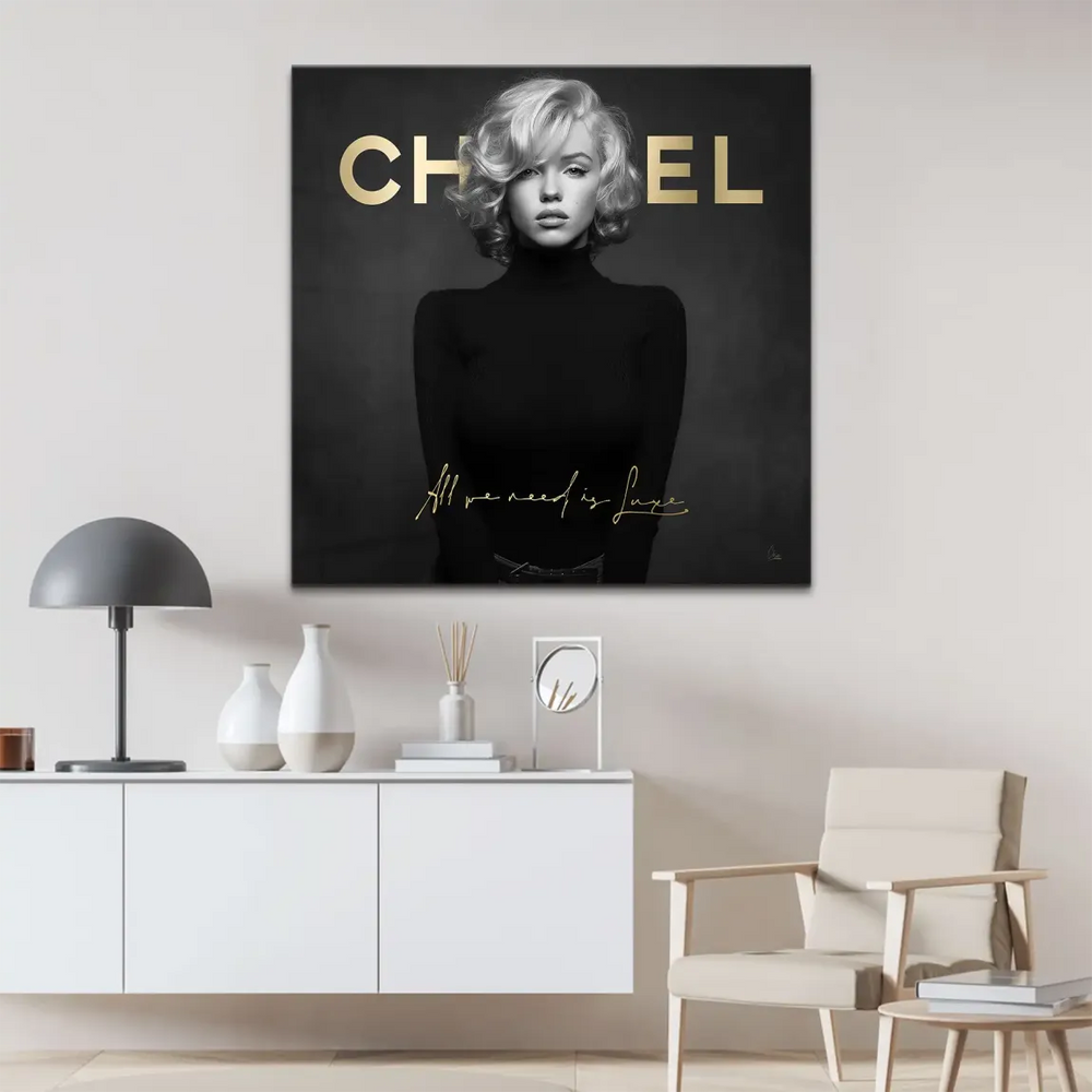 Square-format wall art showing a black-and-white Marilyn portrait with luxe gold lettering