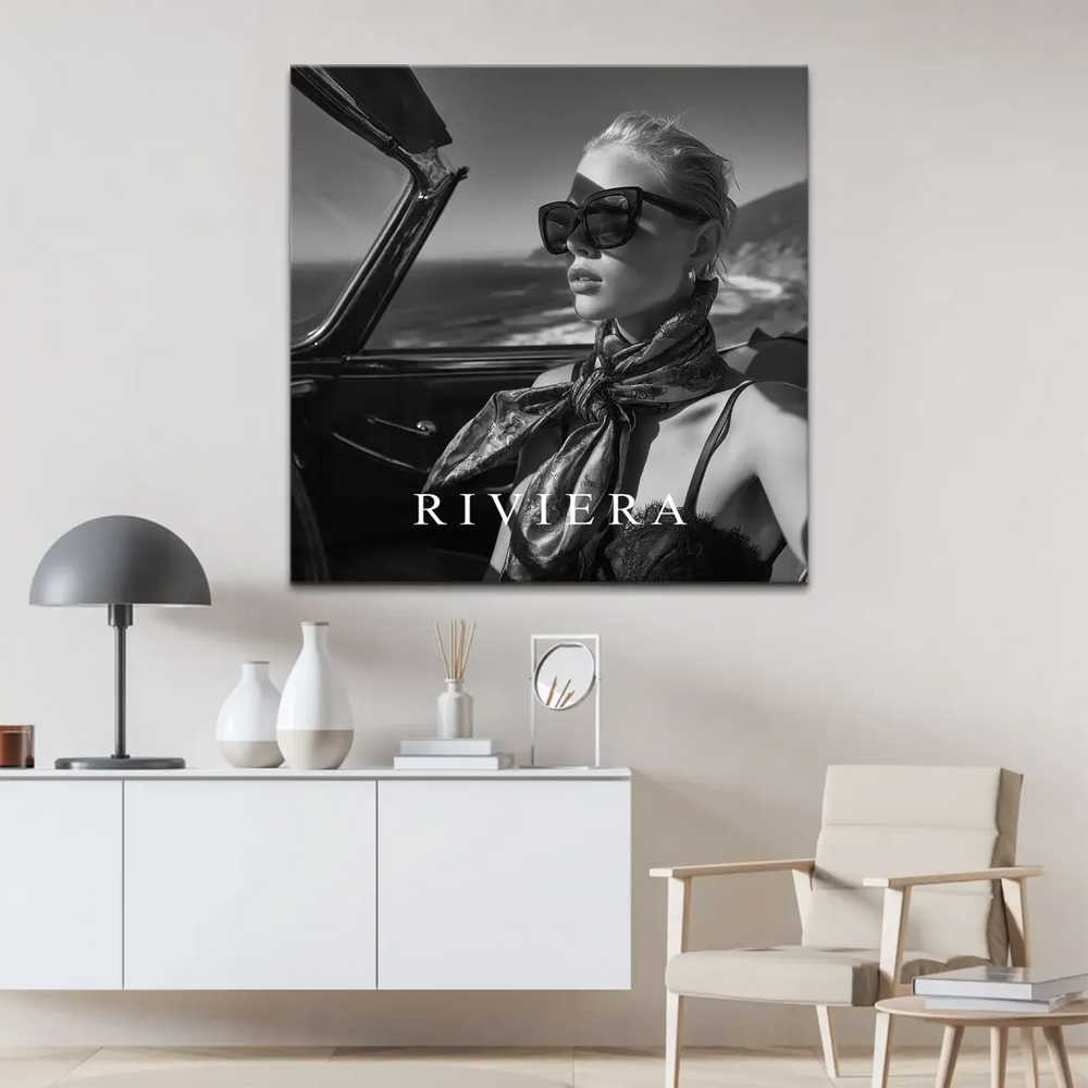 Profile view of glamorous woman in a vintage car, high-contrast monochrome portrait
