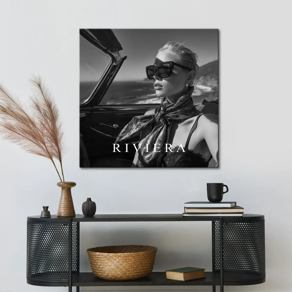 Coastal road and ocean backdrop visible behind stylish convertible in Riviera canvas print