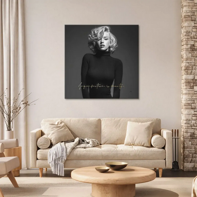 Gold script reading 'Imperfection is beauty' in the corner of the Marilyn Monroe canvas.