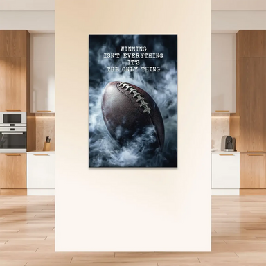 Close-up of the football with silver laces and dramatic lighting for wall decor.