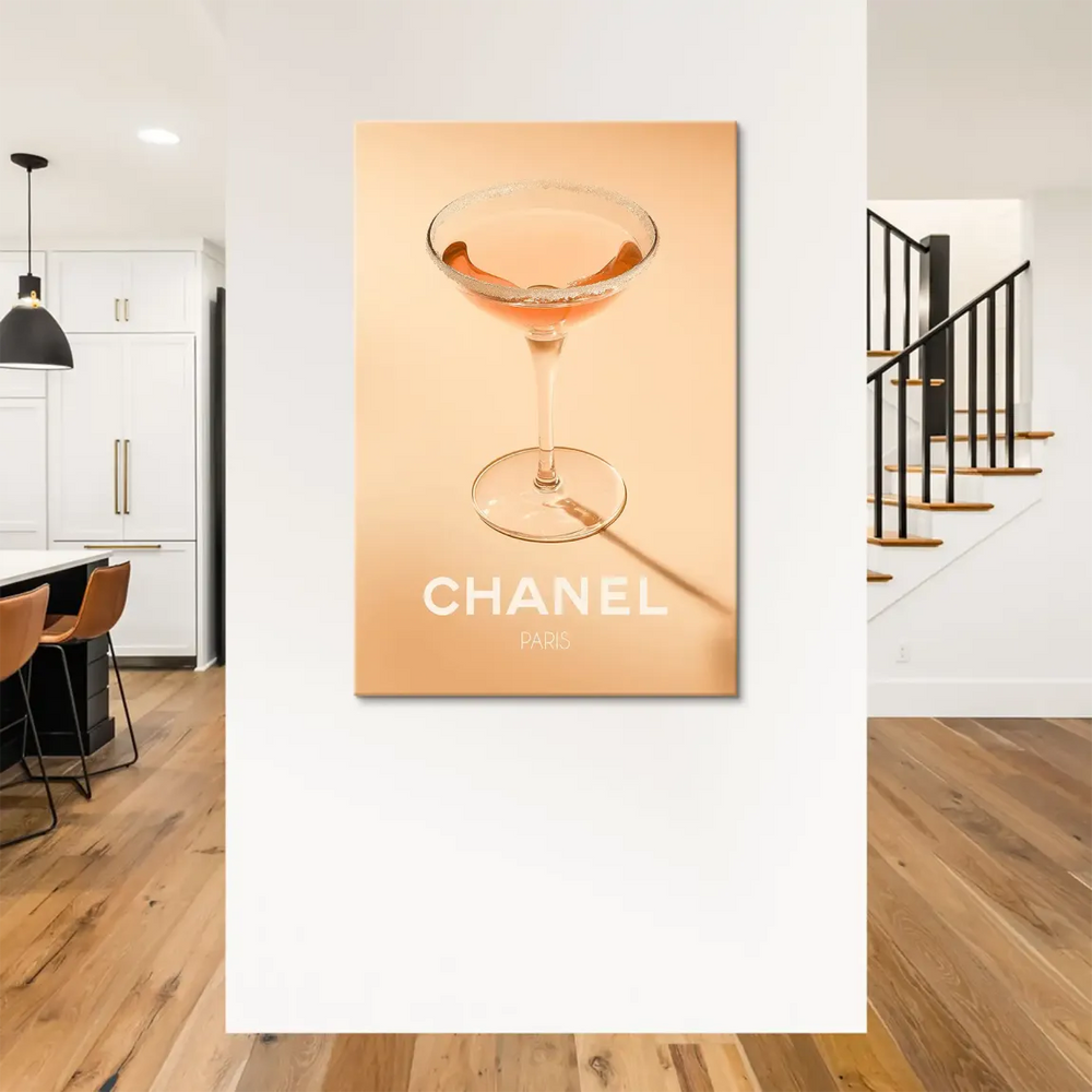 Minimalist fashion wall art with a pink cocktail and Chanel branding for a chic Parisian vibe.