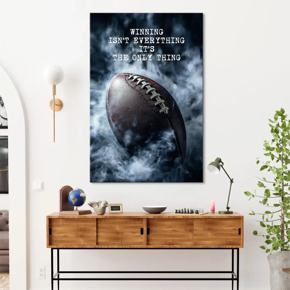 Motivational quote art canvas with bold typography over a football image.