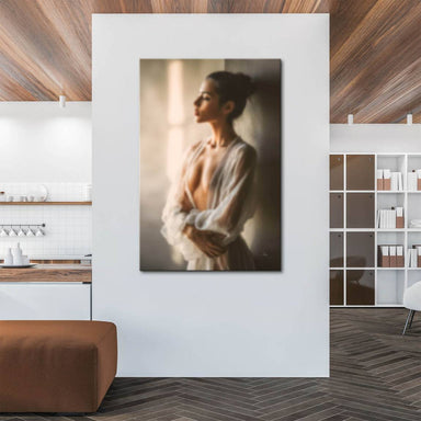 Elegant woman with hair up wearing sheer white garment