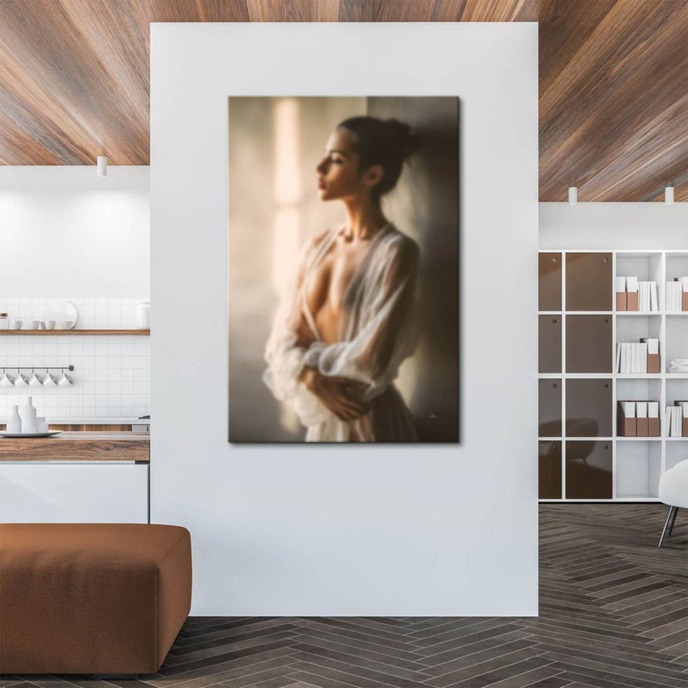 Elegant woman with hair up wearing sheer white garment