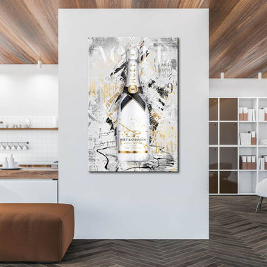 Close-up of a glossy champagne bottle surrounded by gold and black paint splatters in a bold pop art style.