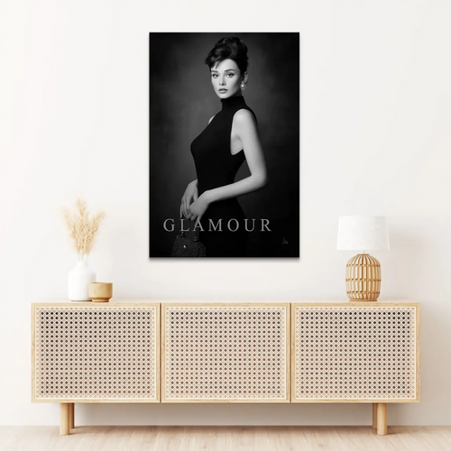Monochrome fashion portrait on canvas showing a poised woman in a black sleeveless dress.
