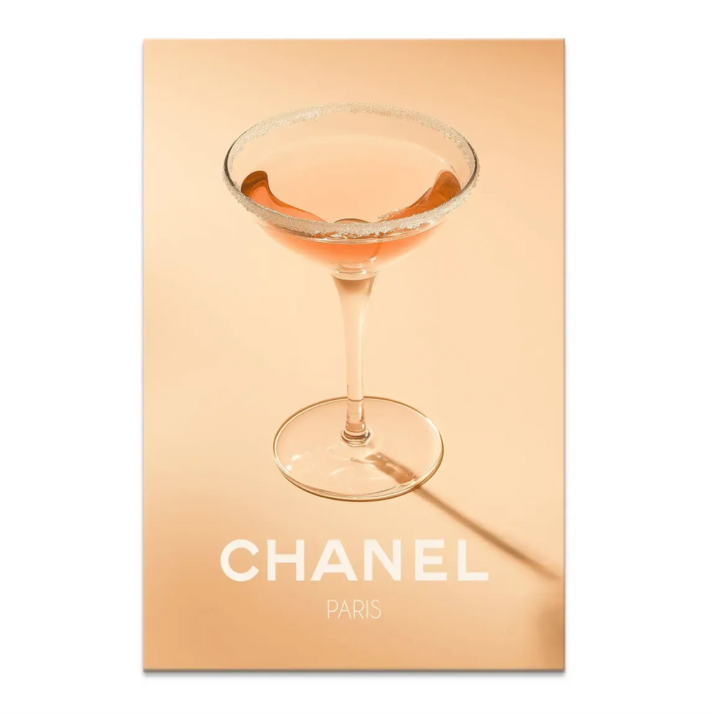 Chanel Glam Cocktail canvas print featuring a pink cocktail in a coupe glass on a peach background with white Chanel PARIS typography.