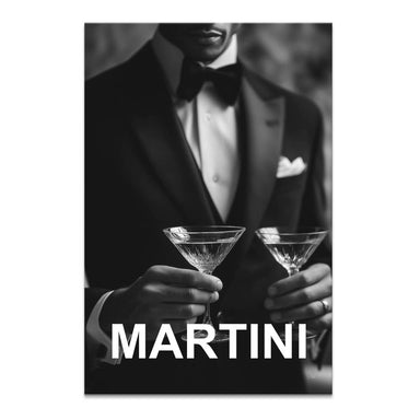 Black and white portrait orientation canvas wall art of a tuxedo-clad gentleman holding two martini glasses with bold MARTINI text.
