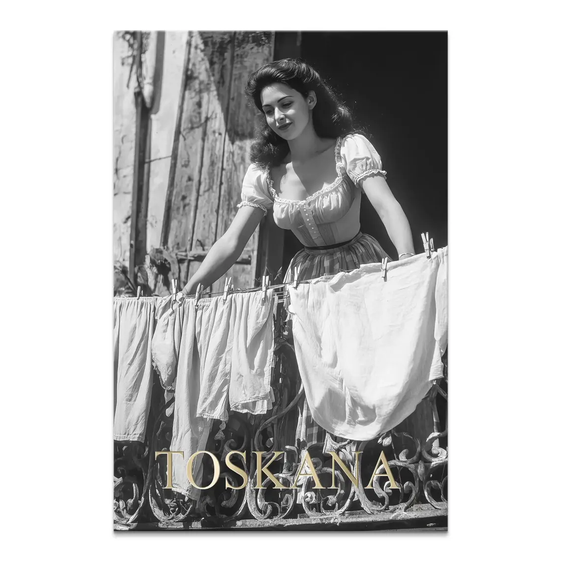 Black-and-white vintage photograph of a woman on a decorative balcony hanging laundry