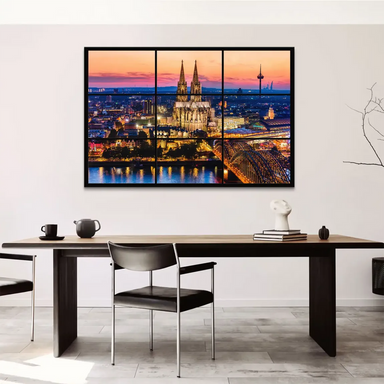 Hohenzollern Bridge crossing the Rhine with twinkling city lights