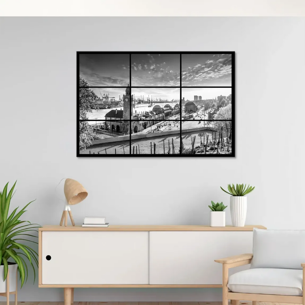 Harbor scene with ships and industrial cranes against a cloudy sky in monochrome.