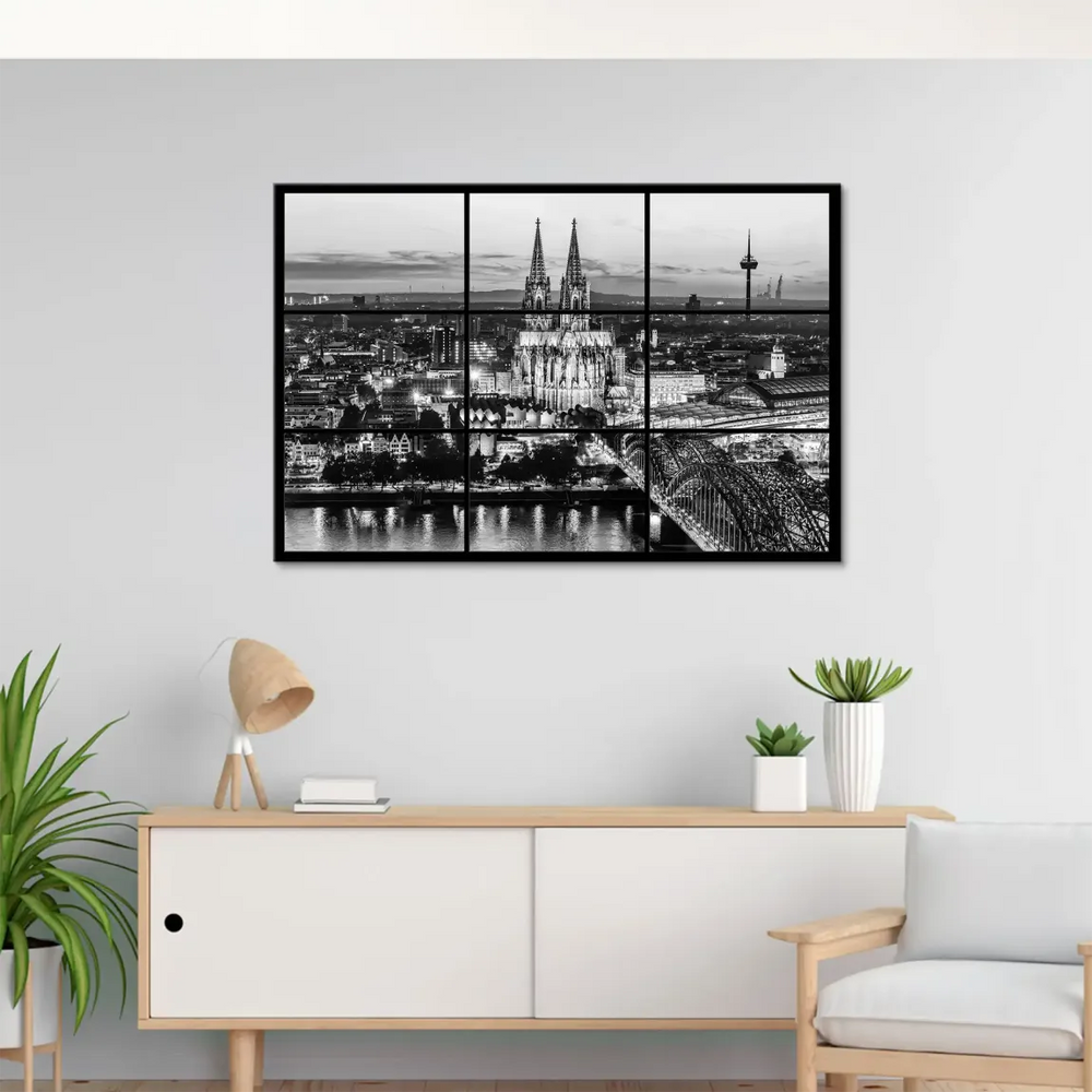 Hohenzollern Bridge spanning the river in a moody noir cityscape.