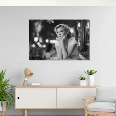 Vintage-style canvas wall art featuring Marilyn Monroe seated at a neon-lit cafe at night.
