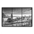 Black and white Hamburg skyline featuring the Landungsbrucken clock tower over the harbor and cranes.
