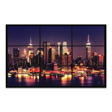 New York City skyline at night with illuminated skyscrapers