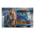 Blonde bohemian woman with flower crown standing beside a colorful classic VW Bulli bus.