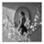 Velvet Muse canvas wall art: black-and-white portrait of a woman reflected in an oval mirror with foreground blossoms.