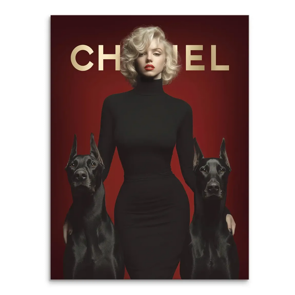 Portrait of a glamorous woman with platinum blonde hair and red lips, wearing a black turtleneck, flanked by two black Doberman dogs against a crimson backdrop and a gold Chanel logo
