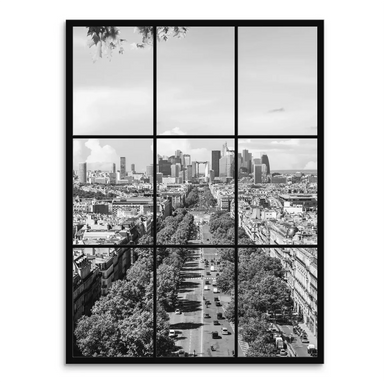High-angle black-and-white Paris cityscape with a tree-lined avenue receding toward the La Défense skyline.