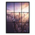 Aerial view of Manhattan skyline at sunrise with tall buildings and a warm gradient sky.