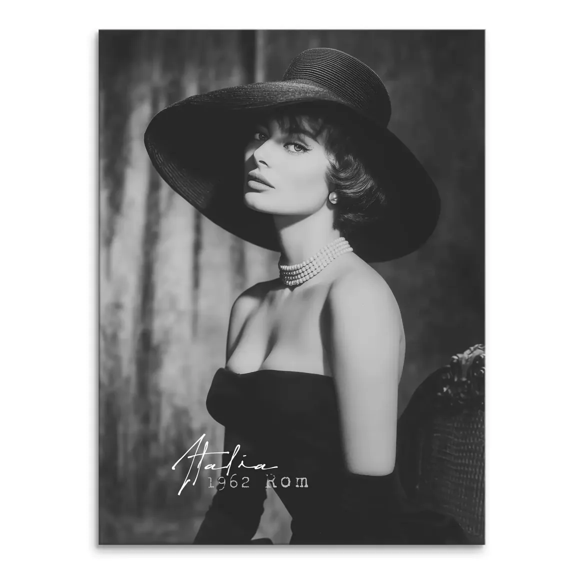 Sophia Loren portrait in black and white wearing a wide-brim hat and pearl necklace