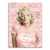 Marilyn Monroe pop art canvas portrait wearing a pink shirt with a distressed Superman logo against a pink and white collage background.