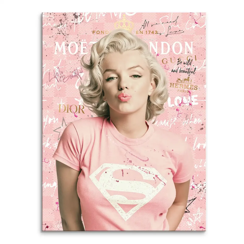 Marilyn Monroe pop art canvas portrait wearing a pink shirt with a distressed Superman logo against a pink and white collage background.