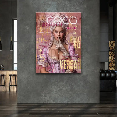 Bright pink and metallic gold portrait on canvas featuring bold typography like COCO CHANEL VERSAILLES.