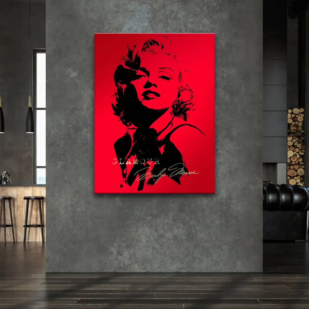 Close-up view of Marilyn's silhouette in black against a vivid red backdrop with gold text.