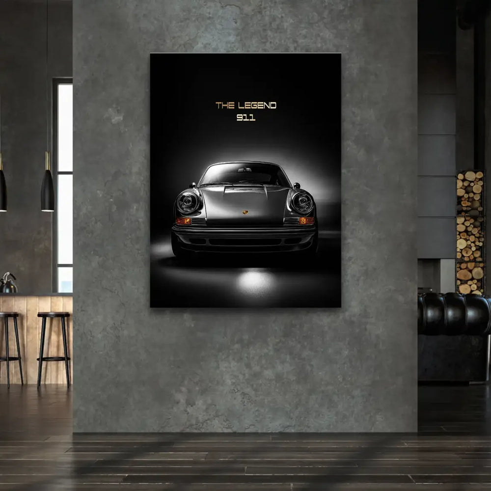 Vintage automotive wall decor with gold accents on the Porsche 911 emblem