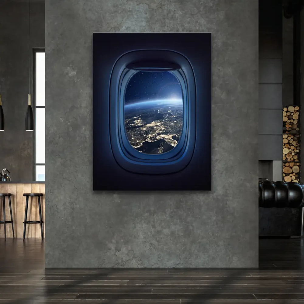 Dark airplane cabin framing a bright sunrise over the curved horizon of Earth