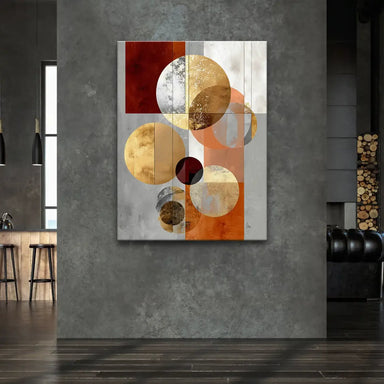 Geometric composition showing matte grey blocks interlaced with reflective rings in gold and bronze